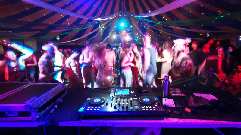 Cosmic Turtle DJing in a tent at Buddhafield, 2026