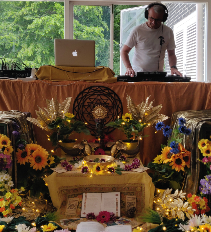Cosmic Turtle DJing at Pollen Tribe with a beautiful altar, 2023